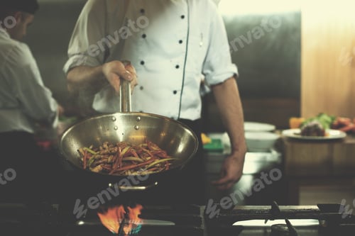 Preview: chef flipping vegetables in wok