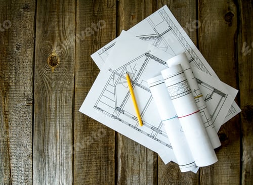 Preview: Many drawings for building and pencils on old wooden background.