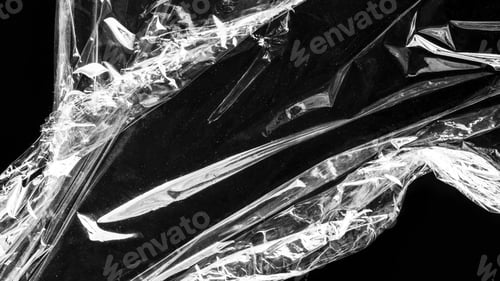 Preview: Wrinkled plastic wrap texture on a black background wallpaper