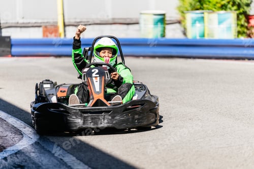 Preview: Woman celebrating victory driving go kart on track