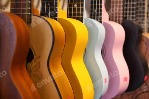 Preview: Row of colorful guitars hanging