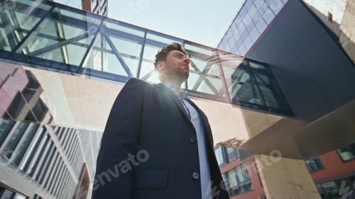 Preview: Business owner standing street under sunlight. Young leader posing near office