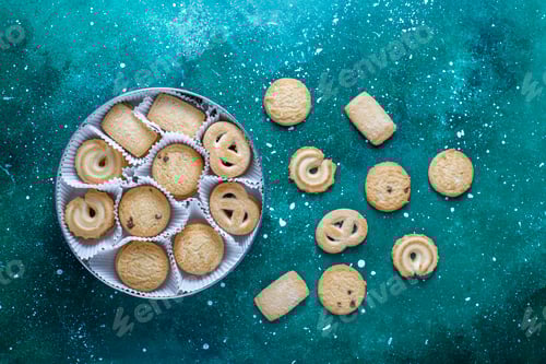 Preview: Delicious Assorted Cookies Arranged on Turquoise Background