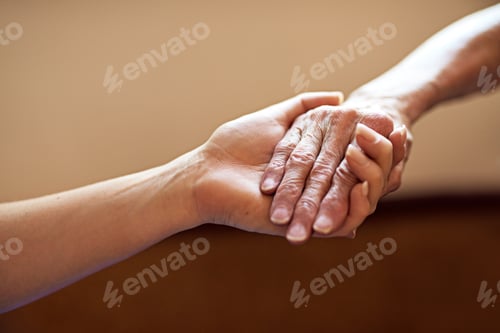 Preview: Cropped shot of a person holding an elderly womans hands