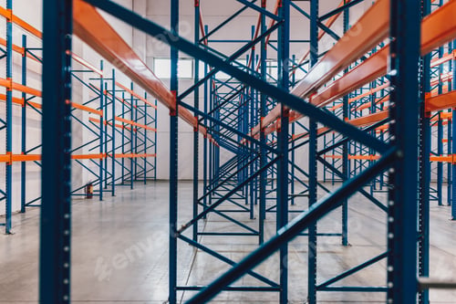 Preview: Interior View of Empty Steel Shelving Units in Warehouse Setting