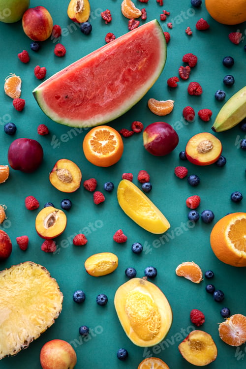 Preview: Tropical fruits on a blue background, flat lay.