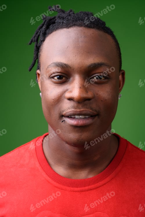Preview: Young handsome African man from Kenya against green background