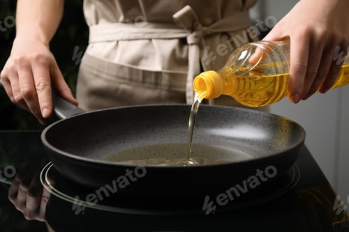Preview: Woman pouring cooking oil from bottle into frying pan, closeup