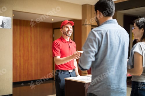 Preview: Man greeting customers at the movies