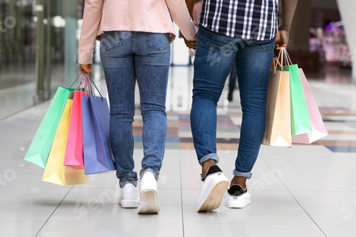 Preview: Shopping Concept. Unrecognizable Man And Woman Doing Purchases In Mall Together