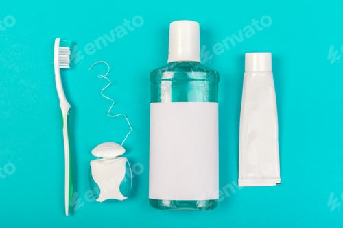 Preview: Items for daily oral care routine on a turquoise background