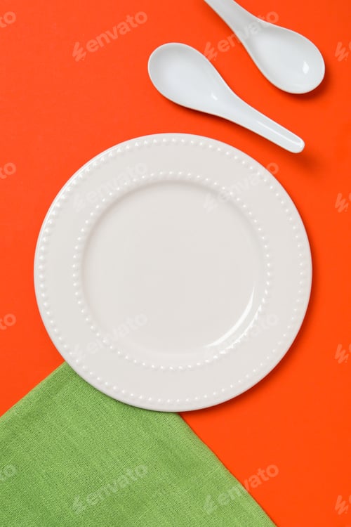 Preview: Minimal table setting with blank dish, top view
