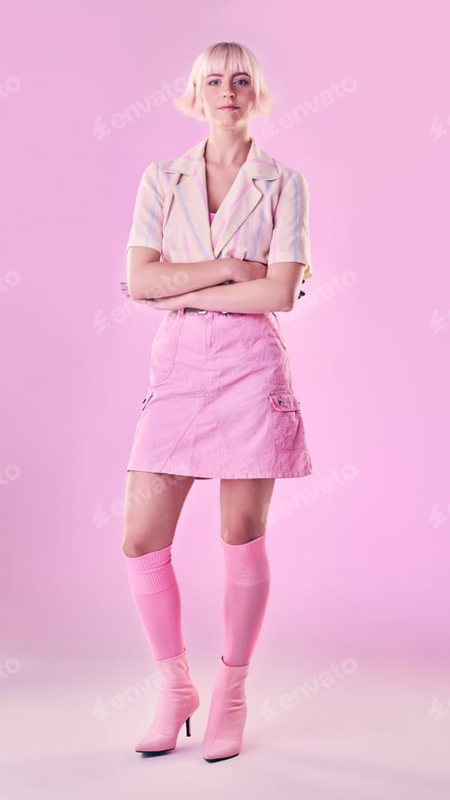 Preview: Portrait, fashion and pink background with a woman in studio, standing arms crossed for contemporar