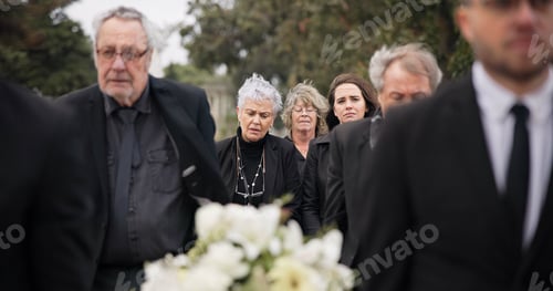 Preview: Pallbearers, men and walking with coffin in funeral, ceremony or mourning event at graveyard with s