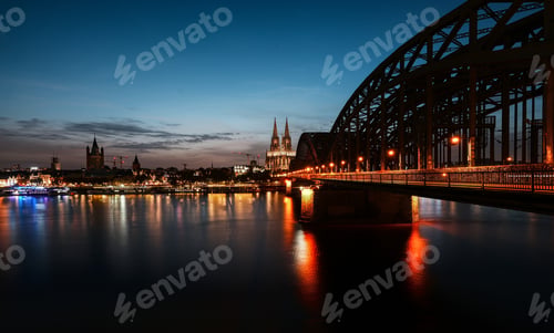 Preview: Stunning sunset in Cologne, Germany, illuminating the city's old town and iconic Cologne Cathedral