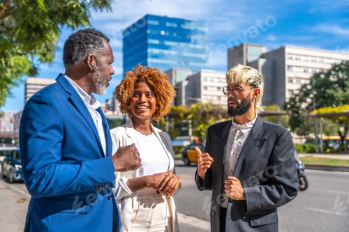 Preview: Multicultural business people talking on the city street