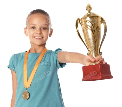 Preview: Happy girl with golden winning cup and medal on white background