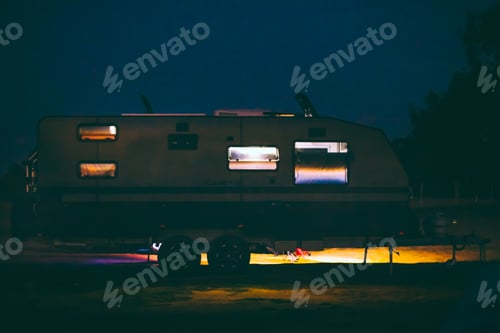 Preview: Travel trailer, caravan at campsite at night