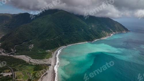 Preview: Beautiful coastal landscape in Taiwan showcasing mountains and clear turquoise waters at midday