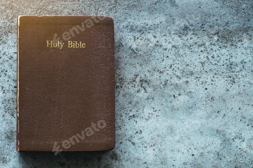 Preview: The Holy Bible is on a cement table.Religion concept