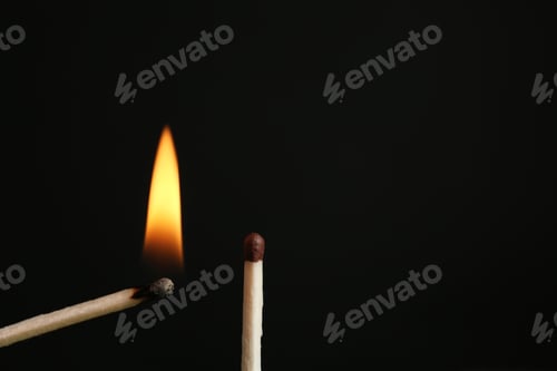 Preview: Lit and whole matches on black background, closeup. Space for text