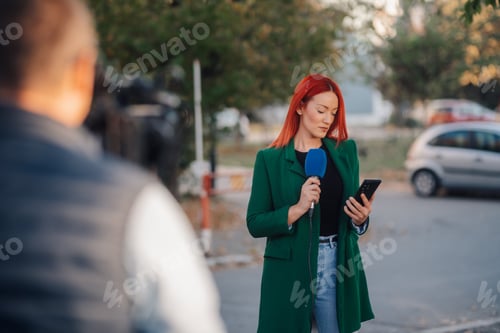 Preview: Female journalist reporting live news with microphone and smartphone