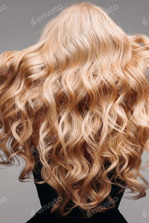 Preview: Stunning woman with perfect wavy blonde hair.