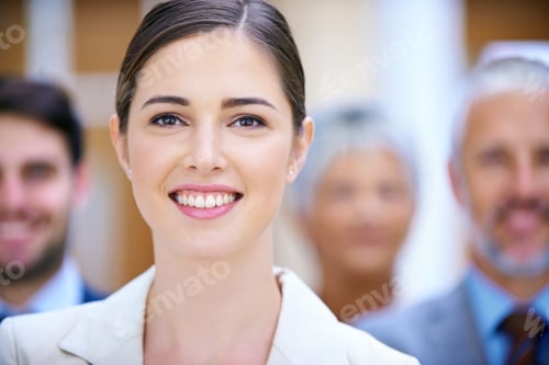 Preview: Shes a shining success. Portrait of a successful businesswoman standing in front of her colleagues.