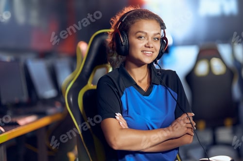 Preview: Portrait of a happy teenage mixed race girl, female cyber sport gamer