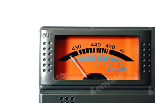 Preview: Closeup shot of a guitar tuner isolated on a white background