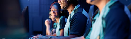 Preview: Professional team playing esports game on computer in internet club