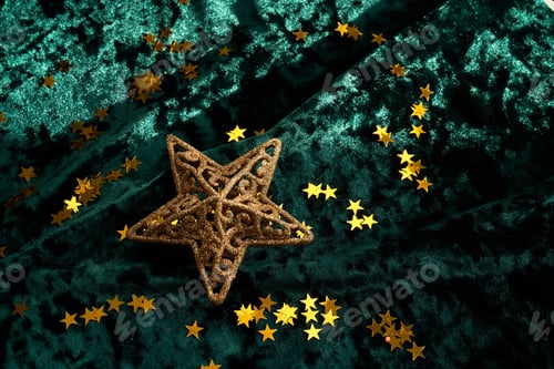 Preview: Abstract Christmas background with gold stars on a green velvet background.