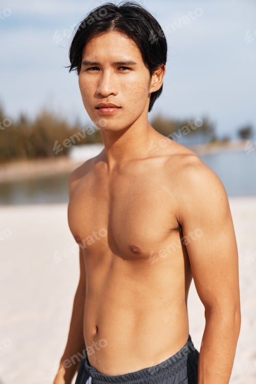 Preview: Muscular Asian Athlete Running on the Beach, Exuding Health and Energy in a Serene Outdoor Setting