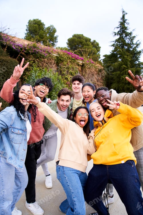 Preview: Vertical. Big group of cheerful Motivated young friends taking selfie portrait looking at the camera
