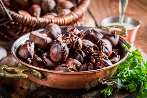 Preview: Closeup of delicious chestnuts with garlic sauce