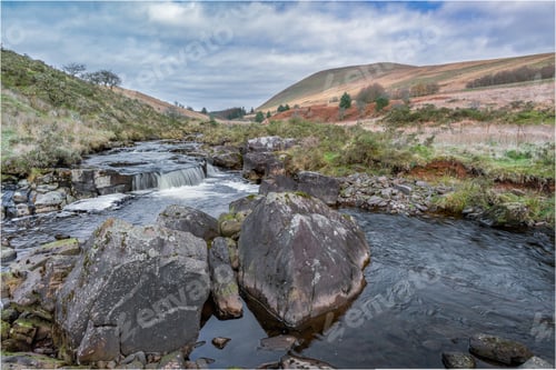 Preview: a view of the water running through rocks on the side of the river
