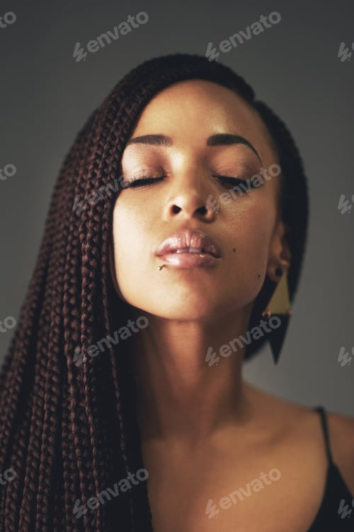 Preview: Its called perfection. Studio shot of a beautiful young woman posing against a gray background.