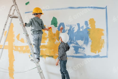 Preview: Two boys painting walls in the domestic room