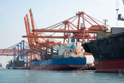 Preview: Big crane loading cargo container from truck to container ship in the international terminal