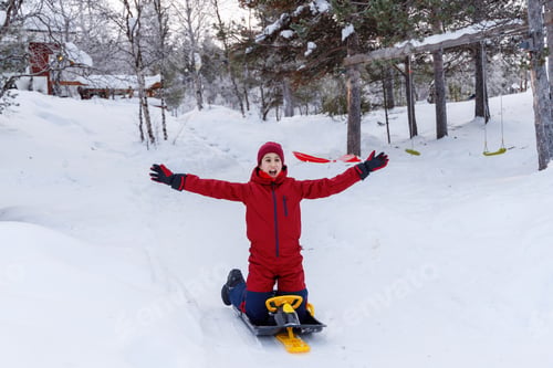 Preview: Girl enjoying sledding in the snow, family trip