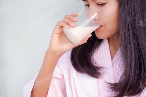 Preview: Woman drinking soimilk. hight calcium and protein food. lifestyle lady concept.