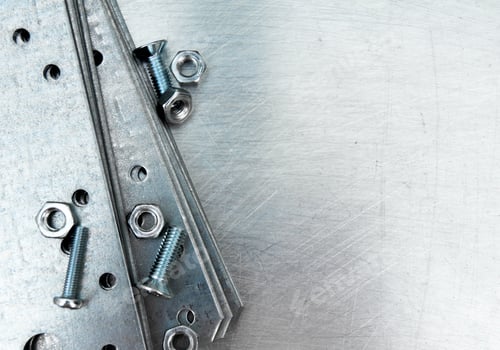 Preview: Metal preparations and fixing elements on the scratched metal background.