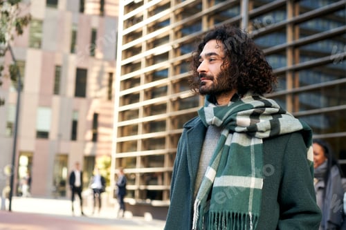Preview: Copy space portrait of a young man outdoors in a corporate environment.