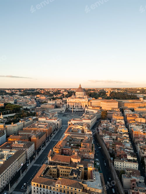 Preview: vertical aerial drone view Vatican City and Rome cityscape during golden hour sunset