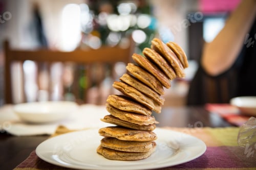 Preview: Stacked High - stack of pancakes tilting