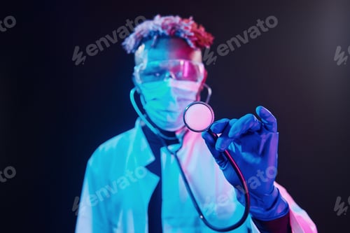 Preview: Smart doctor in protective uniform holding stethoscope. Futuristic neon lighting