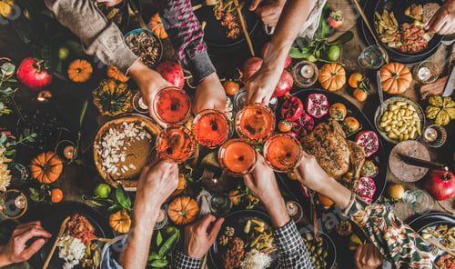 Preview: Family celebrating Thanksgiving day with Autumn food and rose wine