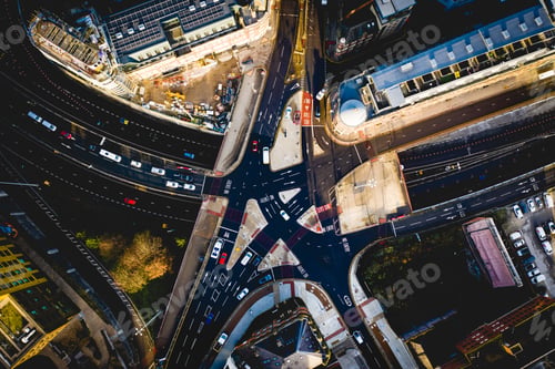 Preview: Aerial view directly above a complicated city street junction or intersection with traffic queueing