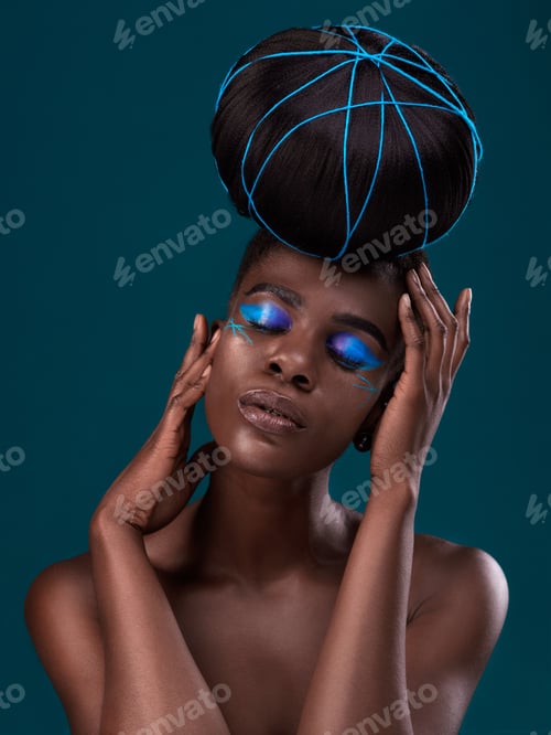 Preview: Studio shot of a beautiful young woman posing against a dark background