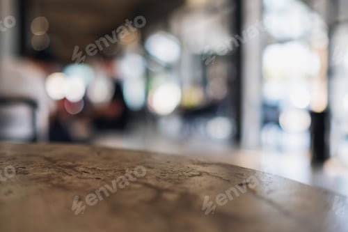 Preview: Closeup image of a concrete table with blur background in cafe